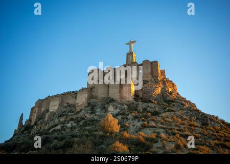 Panoramic view of the impressive Monteagudo Castle, Murcia, Spain, at sunset with the orchard in the background Stock Photo