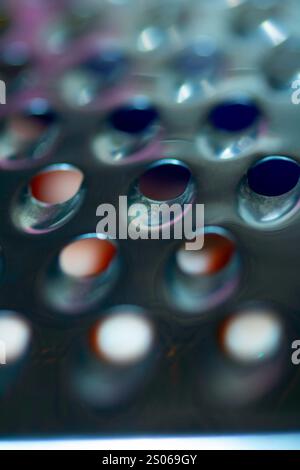 Close Up of a Steel Metal Perferated Hole Background Abstract Futeristic Circles Stock Photo