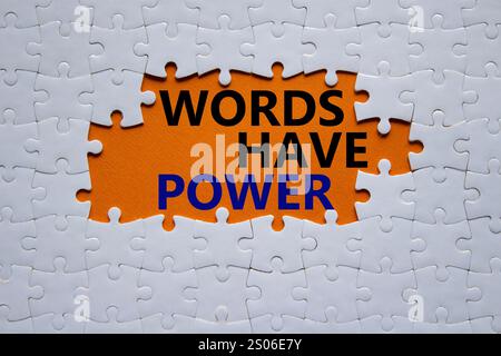 Words have power symbol. Concept words Words have power on white puzzle. Beautiful orange background. Business and Words have power concept. Copy spac Stock Photo