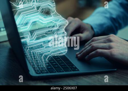 Businessman working on laptop at desk, closeup. Digital head coming out of computer symbolizing artificial intelligence Stock Photo