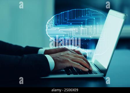 Businessman working on laptop at desk, closeup. Digital brain coming out of computer symbolizing artificial intelligence Stock Photo