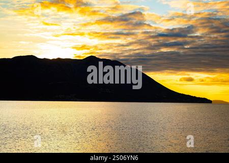 Scenic sunset view of Montenegro mountains at sunset from sea Stock Photo