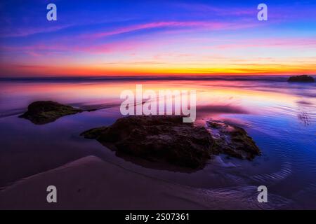 Scenic seascape of sunrise at Caves beach of Australian pacific coast near Newcastle. Stock Photo