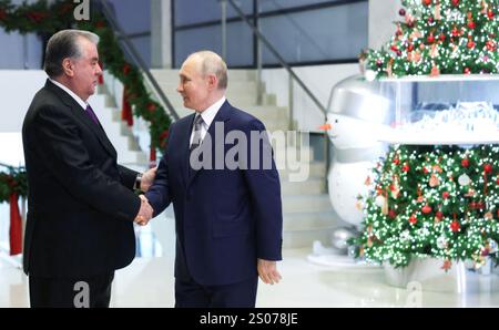 Orekhovo, Russia. 24th Dec, 2024. Russian President Vladimir Putin, right, welcomes Tajik President Emomali Rahmon on arrival for a bilateral meeting at the Igora resort, December 24, 2024 in Orekhovo, Leningrad Oblast, Russia. Credit: Gavriil Grigorov/Kremlin Pool/Alamy Live News Stock Photo