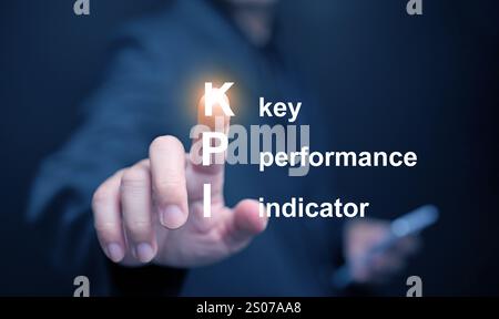 KPI key performance indicator. A businessman tapping on virtual screen to use KPIs to measure progress of his business, project, or work over time to Stock Photo