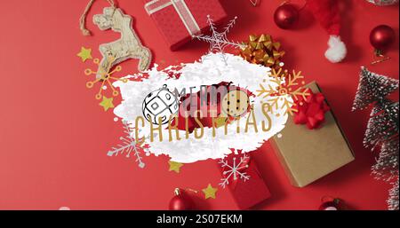 Image of merry christmas text over christmas decorations Stock Photo