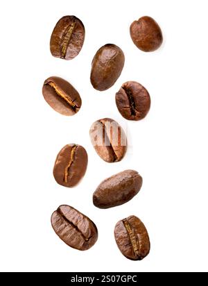 Aromatic roasted coffee beans falling into cup on white background ...