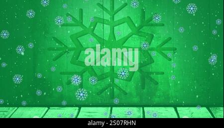 Image of snowflakes falling over wooden plank against snowflake icon on green background Stock Photo