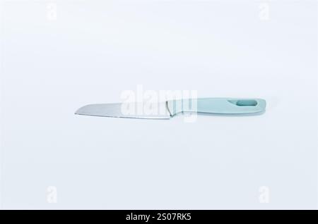 Minimalist Kitchen Knife with Light Blue Handle on White Background Stock Photo