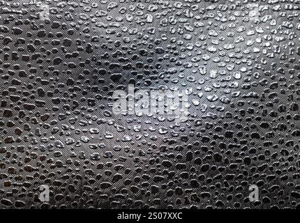 Full frame macro abstract texture background of a black color embossed vinyl fabric background Stock Photo