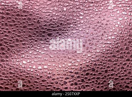 Full frame macro abstract texture background of a pink color embossed vinyl fabric background Stock Photo