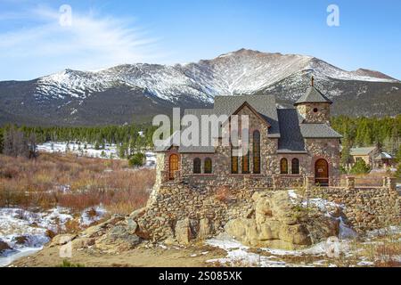 Church and snow covered mountain alpine forest view at Camp St. Malo in Rocky Mountain National Park Colorado Stock Photo