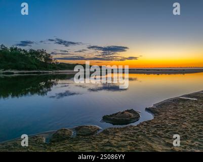 Aerial sunrise over the lagoon and beach at  Wamberal on the Central Coast, NSW, Australia. Stock Photo