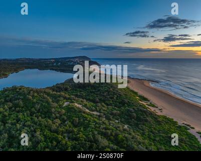 Aerial sunrise over the lagoon and beach at  Wamberal on the Central Coast, NSW, Australia. Stock Photo