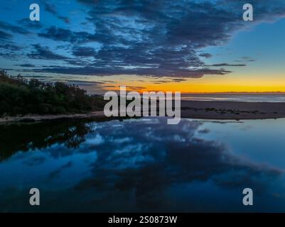 Aerial sunrise over the lagoon and beach at  Wamberal on the Central Coast, NSW, Australia. Stock Photo