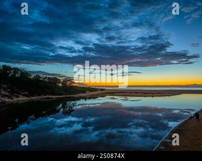 Aerial sunrise over the lagoon and beach at  Wamberal on the Central Coast, NSW, Australia. Stock Photo