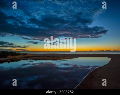 Aerial sunrise over the lagoon and beach at  Wamberal on the Central Coast, NSW, Australia. Stock Photo