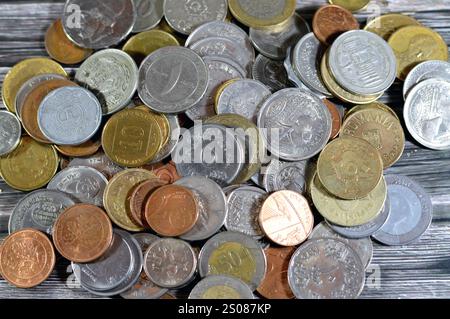 Pile of various coins from different countries from the world, vintage retro old coins with different values and from different times and eras, old co Stock Photo