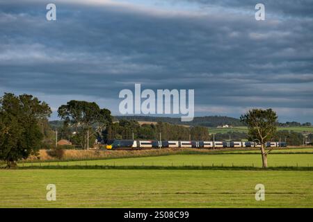 Avanti west coast class 390 Pendolino train passing the countryside at Plumpton (north of Penrith) on the west coast mainline in Cumbria Stock Photo