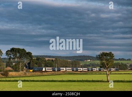 Avanti west coast class 390 Pendolino train passing the countryside at Plumpton (north of Penrith) on the west coast mainline in Cumbria Stock Photo