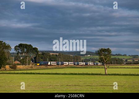 Avanti west coast class 390 Pendolino train passing the countryside at Plumpton (north of Penrith) on the west coast mainline in Cumbria Stock Photo