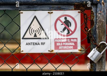 Caution Radio Transmitters Operating warning sign at a mobile cell phone tower Stock Photo