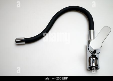 Detail of a Single lever sink mixer black spout chrome saver isolated on white background Stock Photo