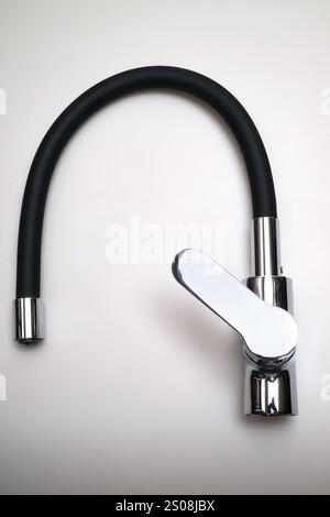Single lever sink mixer black spout chrome saver isolated on white background Stock Photo