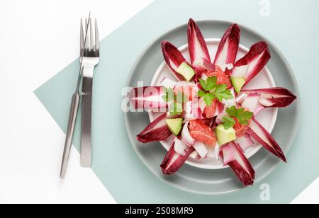 Red chicory salad with grapefruit and avocado Stock Photo