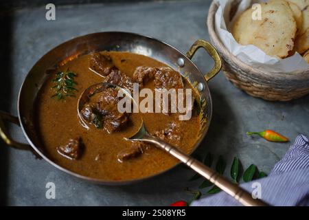 Key Pathal Lamb curry served with Ney Pathal | Kerala breakfast meal Stock Photo ...