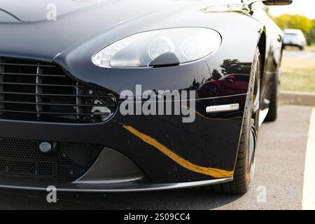 Chicago, Illinois, USA - September 08, 2024: 2008 Aston Martin V12 Vantage GT black sportscar, light view. Aston Martin V12 Vantage GT. Convertible Stock Photo