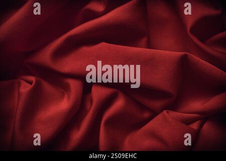 A dark red fabric texture background. Close up. Stock Photo