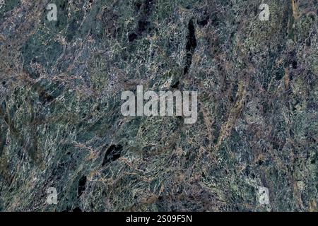 Natural green marble background with intricate veins and organic patterns. Polished wall surface Stock Photo