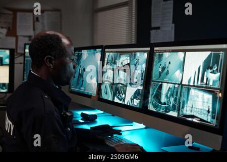 cctv screen. CCTV monitors in control room at Cardiff Central Police ...