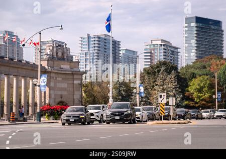 Toronto, Ontario, Canada - 09 22 2024: A line of cars at a traffic light on Strachan Avenue at Lake Shore Boulevard with high-rises of the King West V Stock Photo