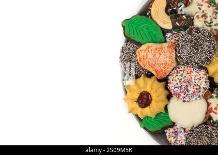 Christmas cookies assorted shortbread partial plate snacks white background copy space. Stock Photo