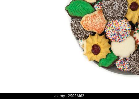Christmas cookies assorted shortbread partial plate snacks white background copy space. Stock Photo