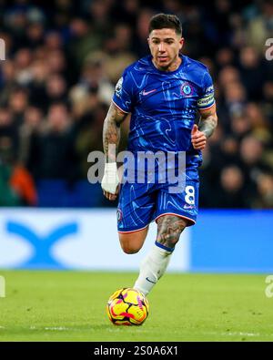 Enzo Fernandez of Chelsea runs with the ball during the Premier League match Chelsea vs Fulham at Stamford Bridge, London, United Kingdom, 26th December 2024  (Photo by Izzy Poles/News Images) Stock Photo