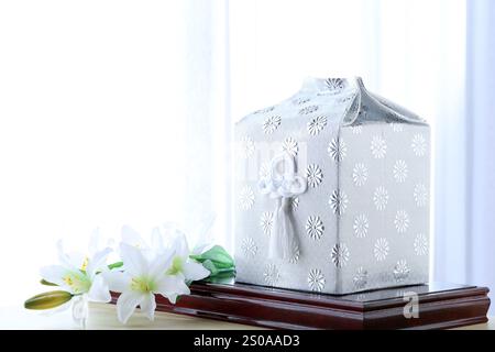 Simple funeral scene in an ordinary Japanese household, on white background Stock Photo