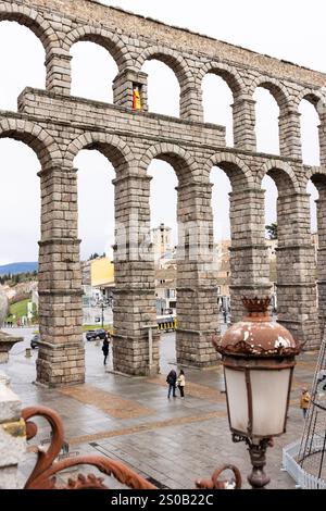 The famous Roman aqueduct in Segovia, Spain, built under emperors Vespasian and Trajan in the first two centuries CE. Stock Photo