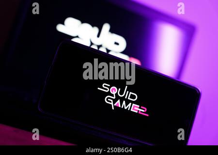 TV show Squid game 2 logo displayed on smartphone screen. December 26, 2024. High quality photo Stock Photo