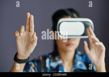 Unrecognizable Female Office Worker Using VR Headset Stock Photo