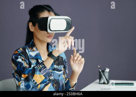 Young Office Worker Using VR Technology Stock Photo