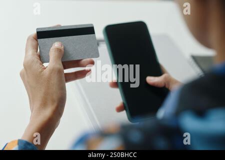 Unrecognizable Woman Using Bank Card For Online Shopping Stock Photo