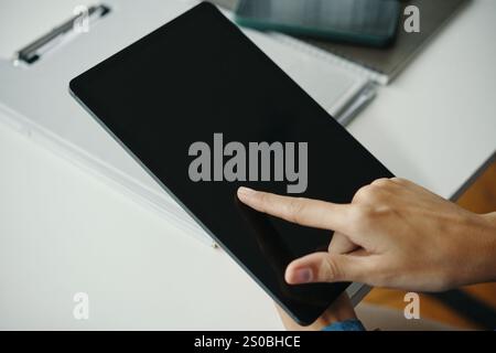 Unrecognizable Woman Using Digital Tablet Stock Photo