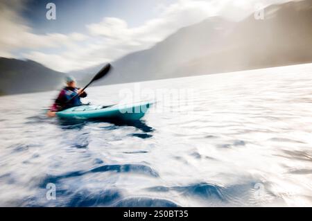 Middle aged woman kayaking on Lake Crescent, Olympic National Park, WA, USA Stock Photo