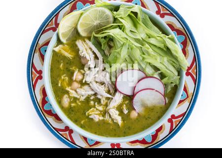 Traditional mexican green pozole soup isolated on white background. Top view. Copy space Stock Photo