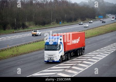 Maritime lorry carrying a HMM container on the M40 motorway, Warwickshire, UK Stock Photo