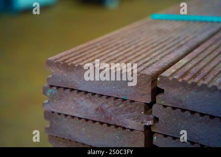 Building material made from recycled plastic waste. Circular and sustainable building with waste plastic material. Plastic recycling. Stock Photo