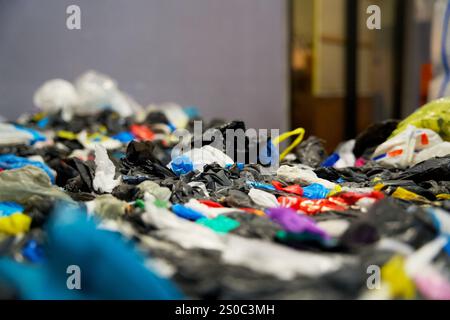 Stack of plastic residual mix waste in a plastic recycling factory Stock Photo